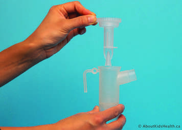 The nebulizer insert is placed into the nebulizer cup
