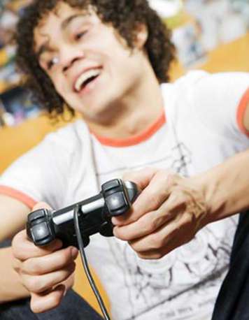 Teen boy playing video game